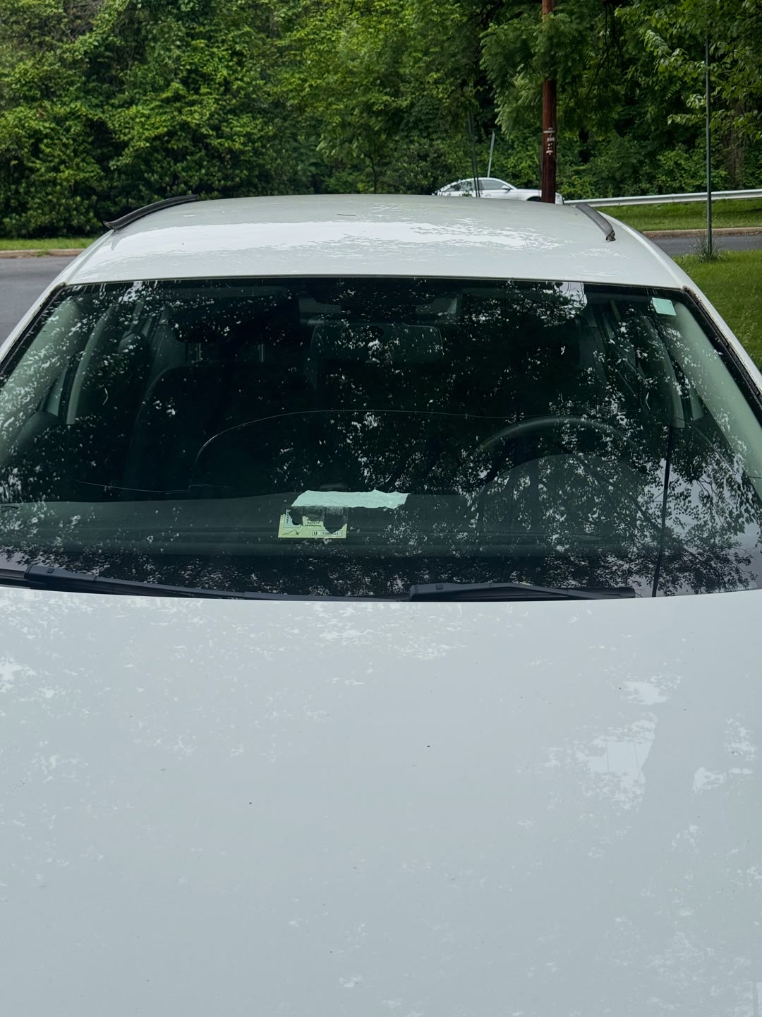 Windshield replacement on a white Volkswagen Jetta, from removal to clean install